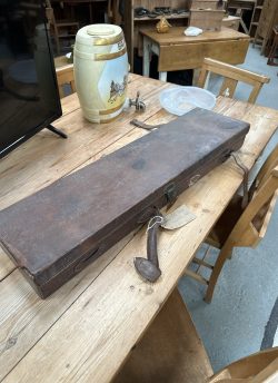 Leather gun case and cleaning rods