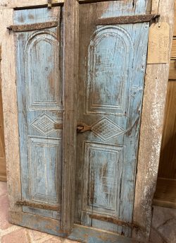 Wooden window frame and shutters.